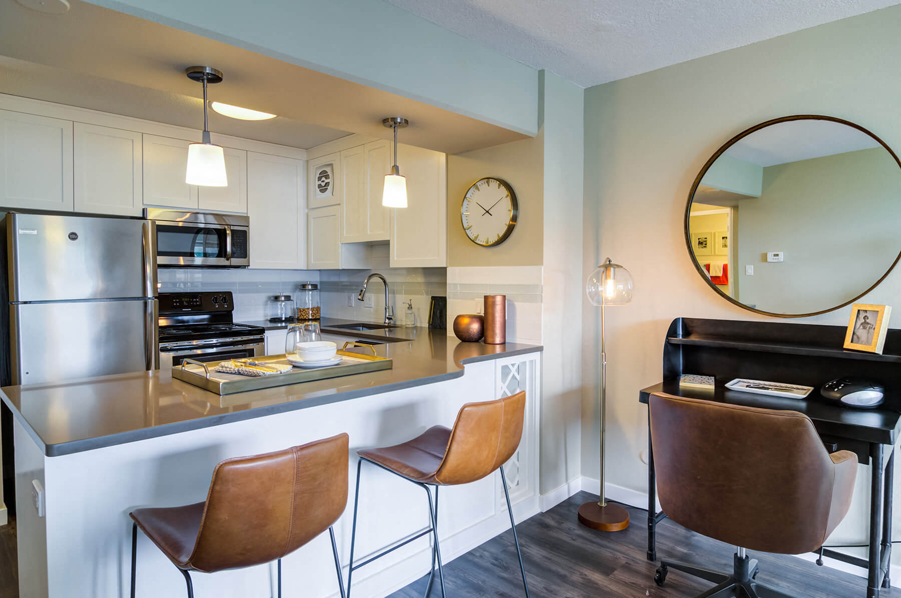 A modern kitchen and desk nook at the 735 St. Clair apartments in Portland, Oregon.